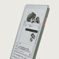 Gallery viewerに画像を読み込む, Viwoods AiPaper Reader Colour shown at an angle against a light gray background, displaying a digital interface with botanical illustrations and text.